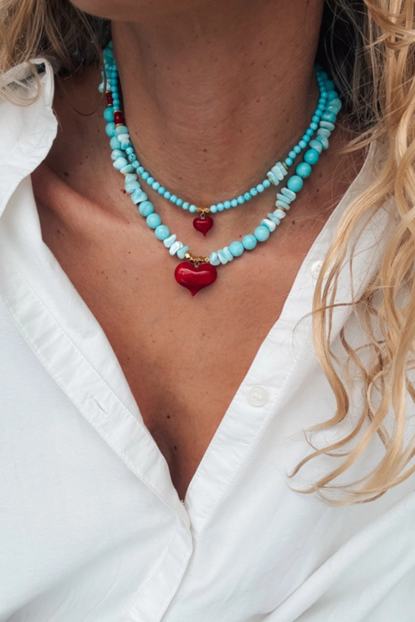 Turquoise beaded necklace with red heart pendant