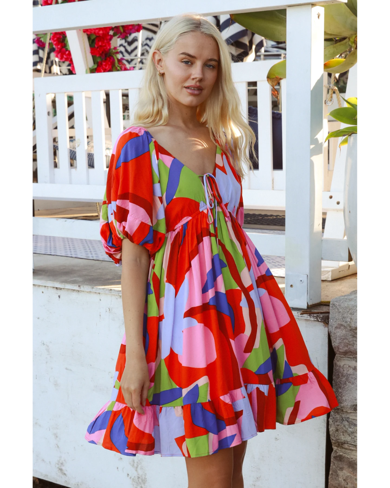 Model wearing vibrant Alberta Mini Dress with oversized fit and colorful abstract print by Avamia Exclusive Print