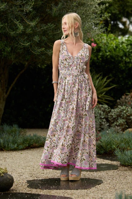 Woman wearing Solara Boheme Esme Maxi Dress with floral print standing outdoors in garden setting