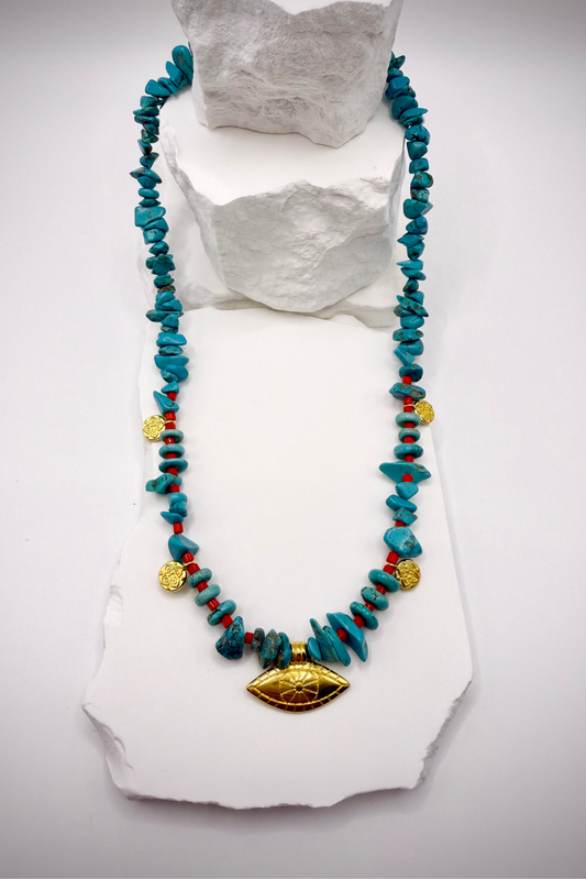 Evil Eye Howlite Necklace by Solara Boheme with turquoise chips red beads and gold plated eye charm handcrafted in Greece