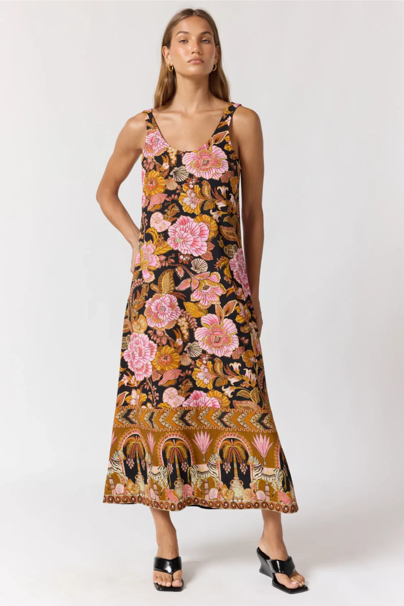 Woman wearing a floral dress with a white background