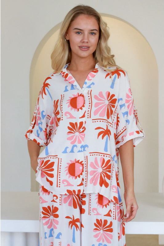 Model wearing Jill Shirt with colorful floral and palm print from My Store in relaxed fit and breathable rayon fabric
