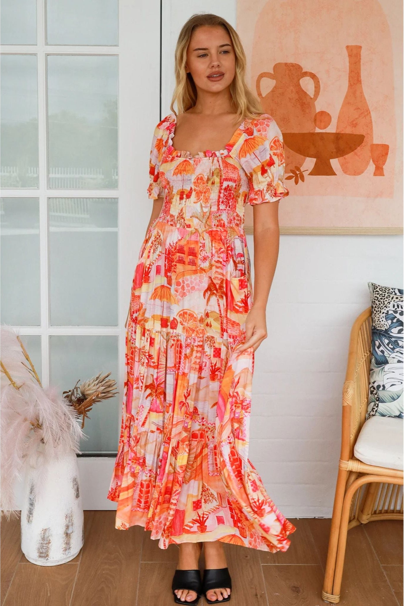 Woman wearing a colorful Maribel Maxi Dress from My Store standing indoors near decor and chair