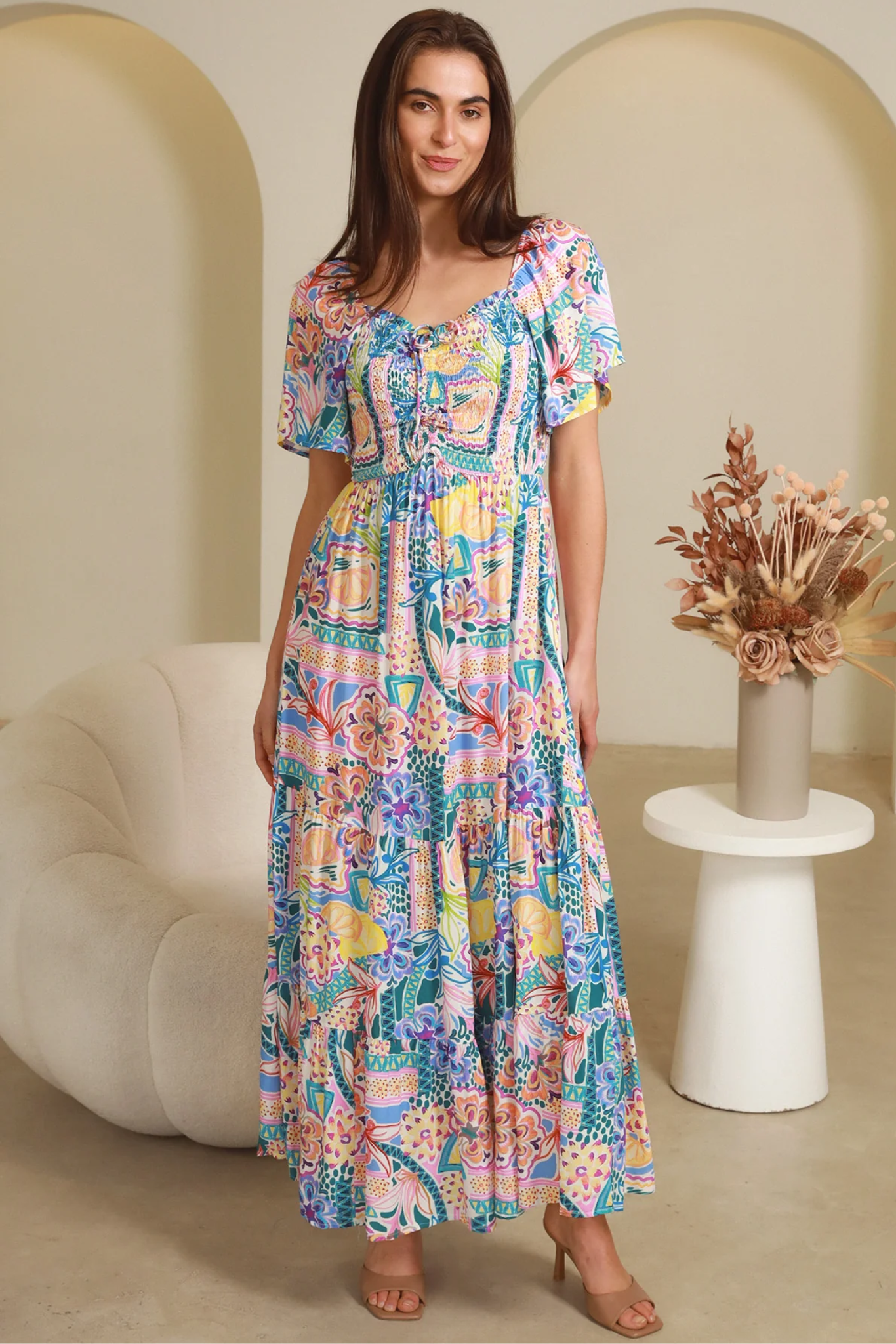 Woman wearing colorful Sharon Short Sleeves Maxi Dress from My Store standing indoors near modern furniture